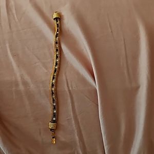 Gold, ruby and diamond tennis braclet.